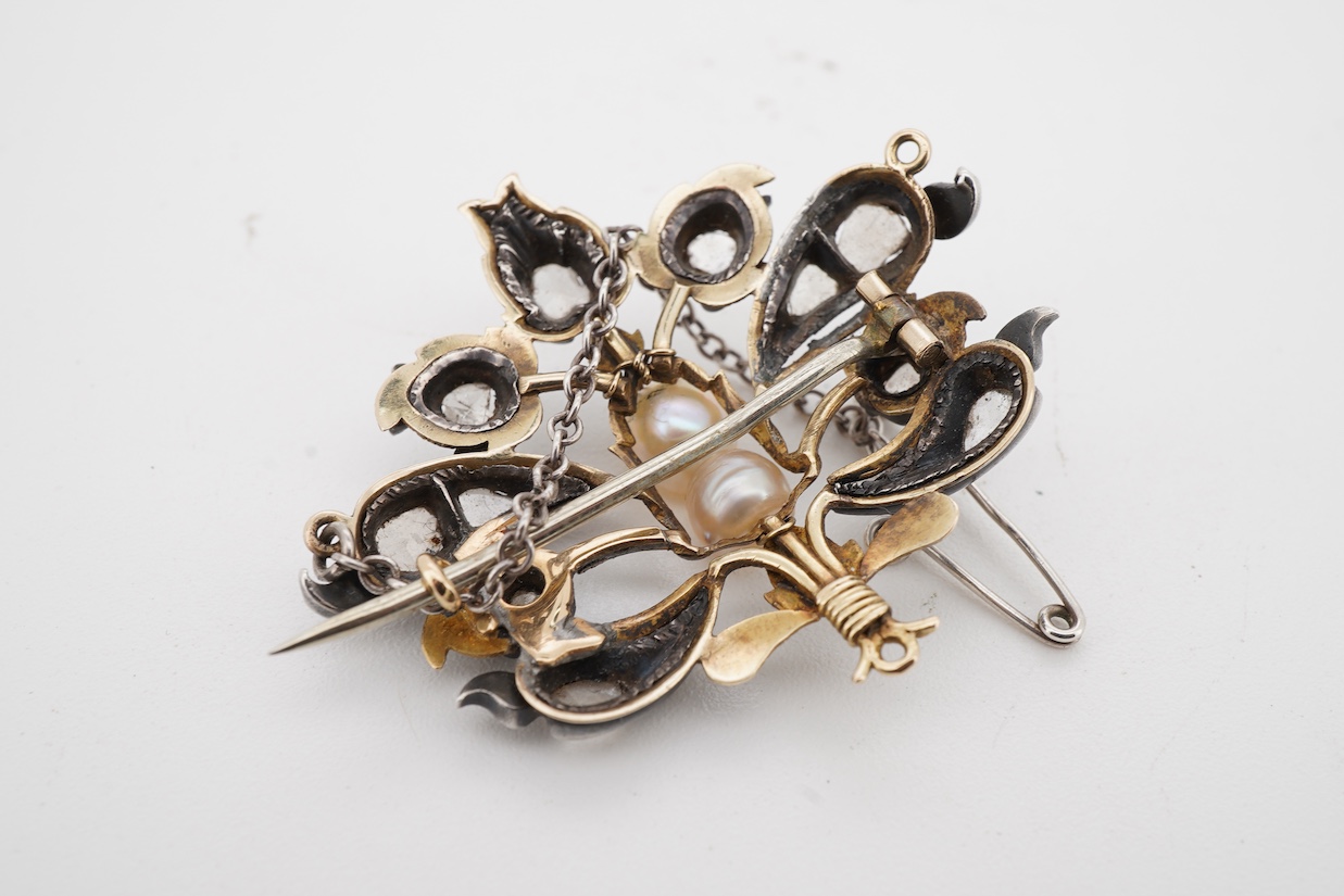 A yellow and white metal, pearl and rose cut diamond set bouquet brooch, width 36mm, pearls untested, with an associated Edward Tessier gilt tooled red leather fitted box.